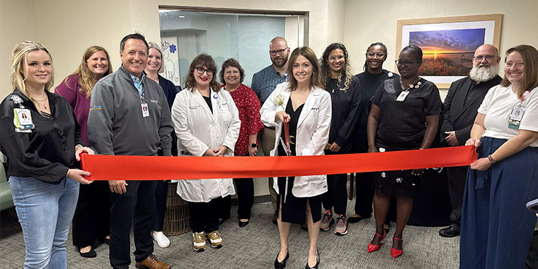 Kalee Woody ribbon cutting